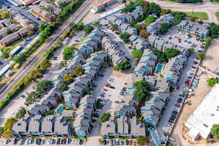 Aerial view of a multi family community that was serviced by ASI Construction with shingled roofs.